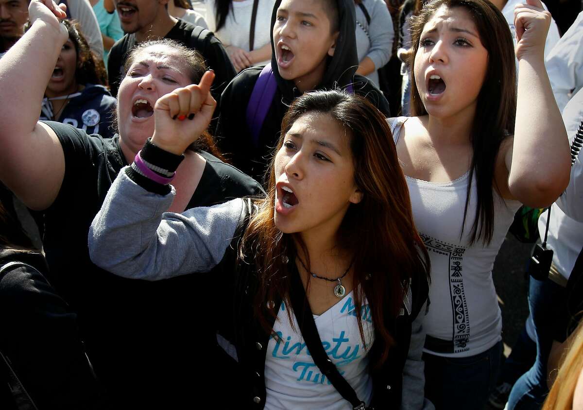 Enadina Cortez (center) and her friends from a local high school chanted Andy's name and scolded the deputies at the rally Tueasday October 29, 2013 in Santa Rosa, Calif. A rally and march to express outrage over the fatal shooting of Andy Lopez Cruz by a Sonoma County sheriff's deputy ended outside the Sheriff's headquarters.