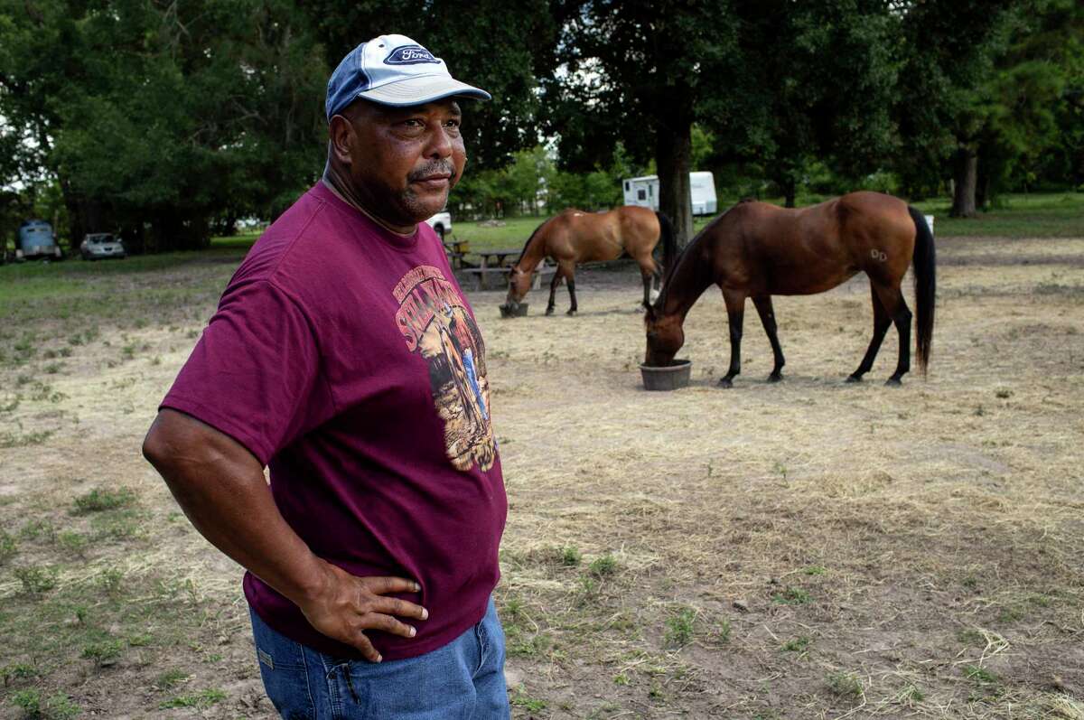 Carl Smith becomes emotional while talking about two of his horses that were found slaughtered nearby Sunday night, on Tuesday, Aug. 11, 2020, at his property in Pearland. "I've never seen anything like it," he said. "They family," he said, describing the personalities of the two horses. Authorities in the city are investigating a string of similar horse killings that have occurred since late May.