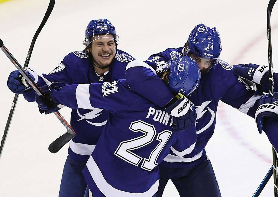 The Tampa Bay Lightning's Brayden Point (21) celebrates his game-winning goal against the Columbus Blue Jackets at 10:27 of the fifth overtime period in Game One of the Eastern Conference First Round playoff series at Scotiabank Arena in Toronto, Canada, on Tuesday, Aug. 11, 2020. The Lightning won, 3-2. (Elsa/Getty Images/TNS) Photo: Elsa / TNS