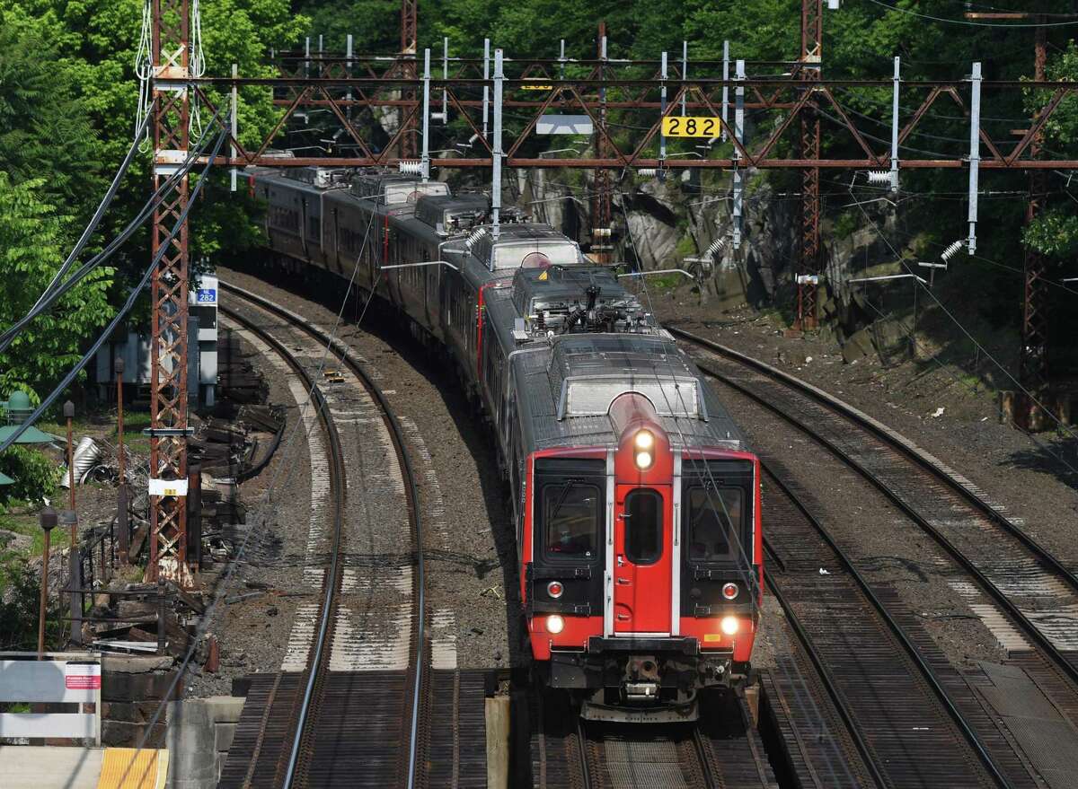 An express train speeds through the Greenwich Metro-North station in Greenwich, Conn. Wednesday, June 10, 2020.