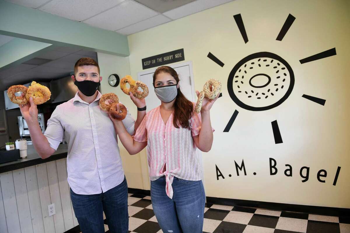 Myron Seniw, left, and his fiancee, Alexis Pollina, are photographed at their business, A.M. Bagel, in Derby on Aug. 7, 2020.