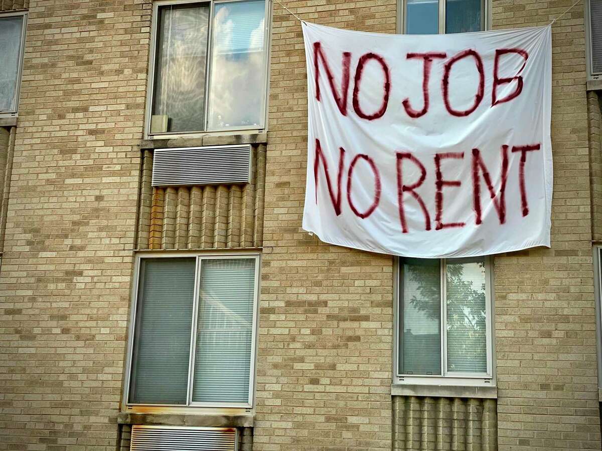 A banner against renters eviction reading no job, no rent is displayed on a controlled rent building in Washington, D.C. With double digit unemployment, disruption to businesses from social distancing rules, and persistent coronavirus spread, many Americans had been relying on relief measures approved earlier by Congress, but which mostly expired in July.
