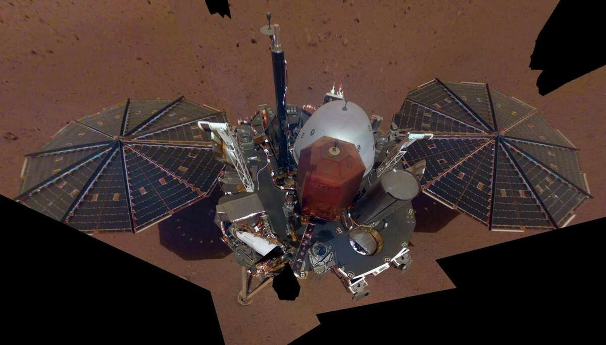 This is NASA InSight's first full selfie on Mars, taken Dec. 6, 2018. The selfie is made up of 11 images that were taken by its Instrument Deployment Camera, located on the elbow of its robotic arm. Those images were then stitched together into a mosaic.