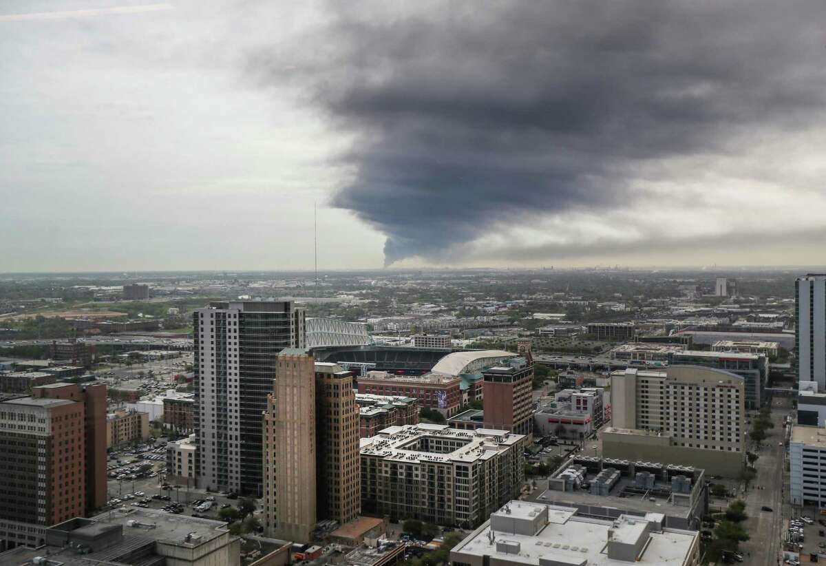 A plume of smoke from a petrochemical plant fire in Deer Park can be seen from the 31st floor of a downtown office building Monday, March 18, 2019, in Houston.