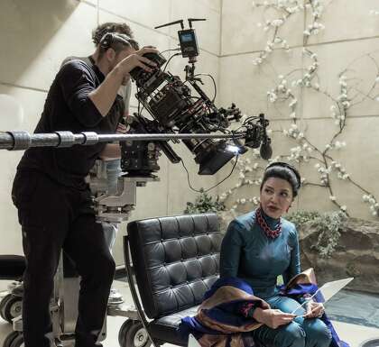 Actor Shohreh Aghdashloo, as Chrisjen Avasarala, holds a clear plastic prop that, after post-production work, becomes a tablet version of the hand terminals used in the Amazon Prime video series "The Expanse."