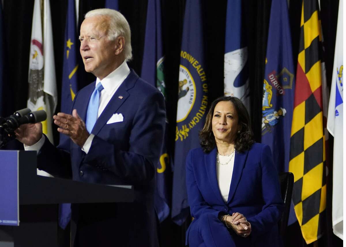 Democratic presidential candidate former Vice President Joe Biden, joined by his running mate Sen. Kamala Harris, D-Calif., speaks during a campaign event at Alexis Dupont High School in Wilmington, Del., Wednesday, Aug. 12, 2020. (AP Photo/Carolyn Kaster)