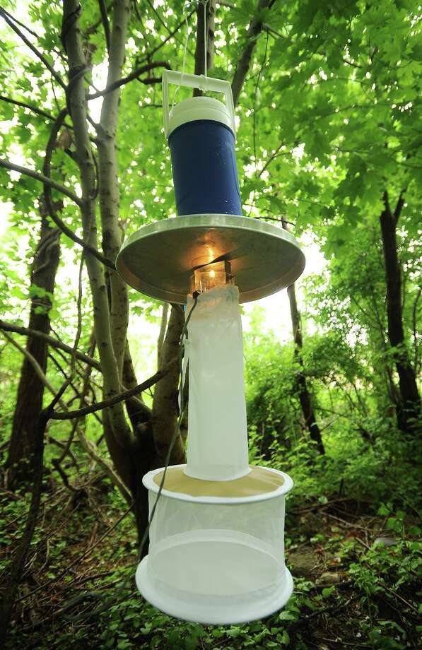 File photo of a mosquito sampling trap, known as a light trap, taken near DeLuca Field on Main Street in Stratford, Conn., on Monday, June 1, 2015. The Connecticut Agricultural Experiment Station collects mosquitoes every year from a wide range of locations to track West Nile Virus. This is not necessarily the type of trap installed in Bridgeport, Conn., in 2020. Photo: Brian A. Pounds / Hearst Connecticut Media / Connecticut Post