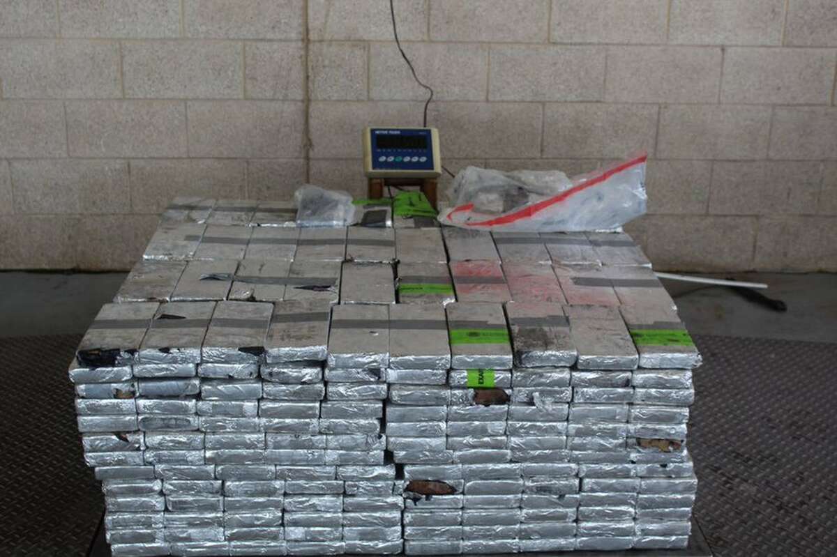 One man is in custody after U.S. Customs and Border Protection agents found nearly $20 million worth of methamphetamine hidden in a produce trailer at a South Texas port.