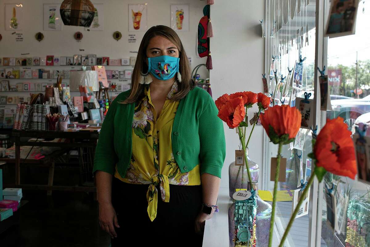 Ginger Diaz stands among the items for sale at Feliz Modern’s West Olmos Drive location.