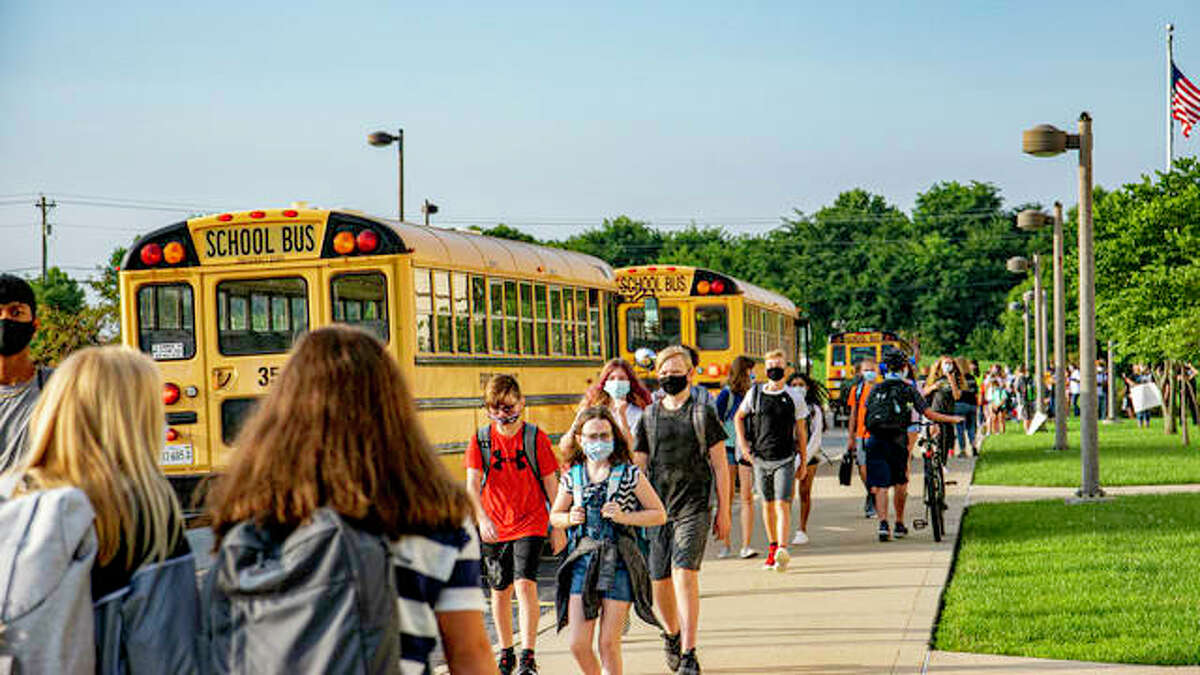 In this file photo, Liberty Middle School students walk to find their appropriate class before beginning the new school year during the pandemic.