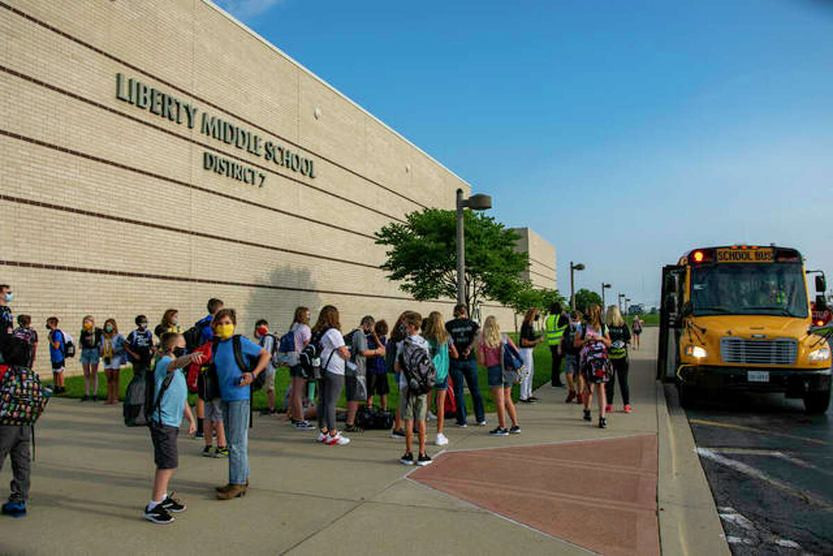 Liberty Middle School students walk to find their appropriate class.