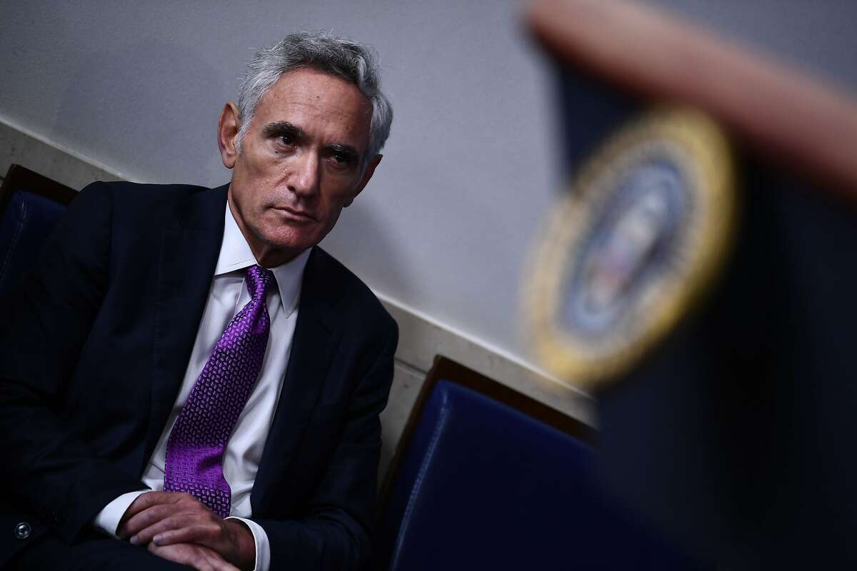 Member of the coronavirus task force Scott Atlas listens to US President Donald Trump during a briefing at the White House August 10, 2020, in Washington, DC. (Photo by Brendan Smialowski / AFP) (Photo by BRENDAN SMIALOWSKI/AFP via Getty Images)