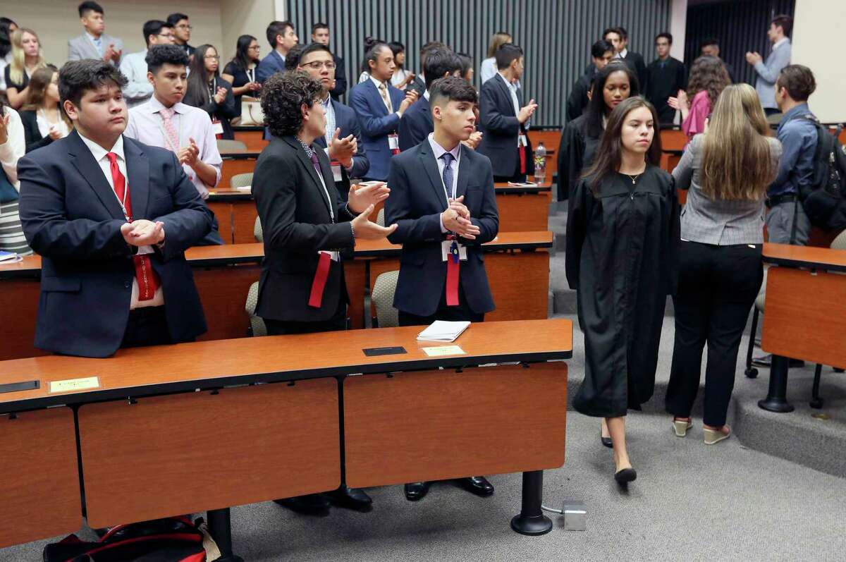Supreme Court judges of the National Hispanic Institute's annual Texas Lorenzo de Zavala Youth Legislative Session, a mock legislative session for high-performing Latino high school students, enter the room at St. Mary's University Law School during the opening ceremonies for the three-day event.