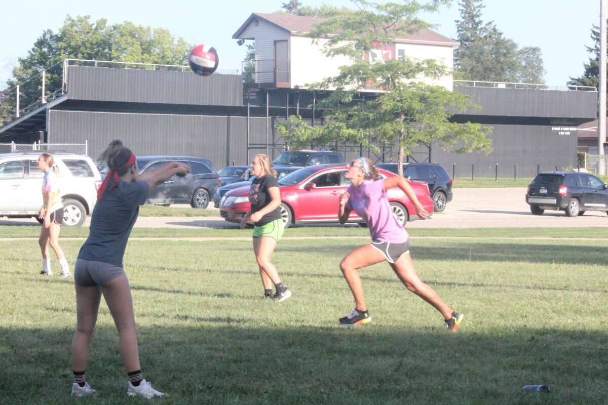 Reed City's volleyball team started its practices outdoors on Wednesday.
