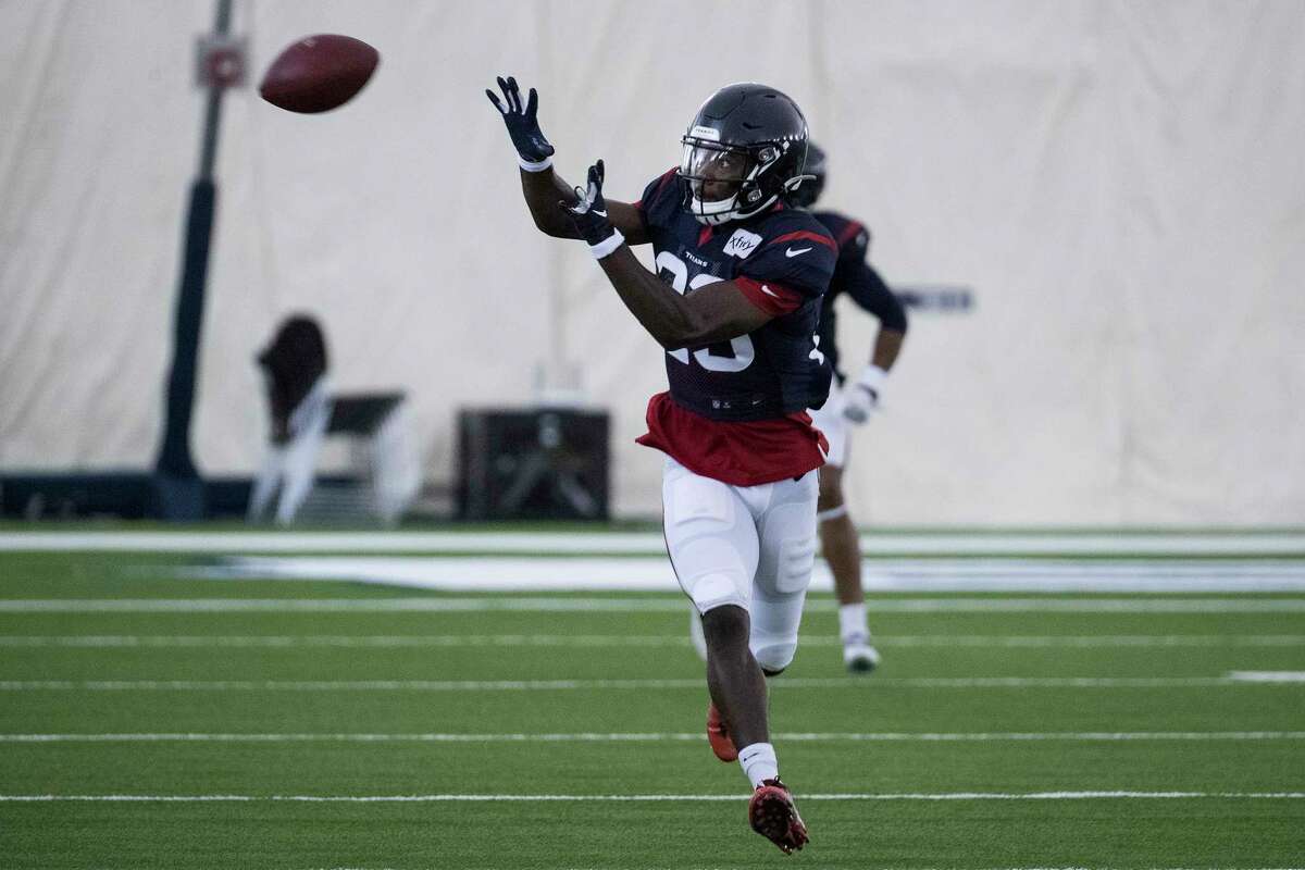 Houston Texans safety Eric Murray (23) reaches out to make a catch during an NFL training camp football practice Saturday, Aug. 15, 2020, at The Houston Methodist Training Center in Houston.