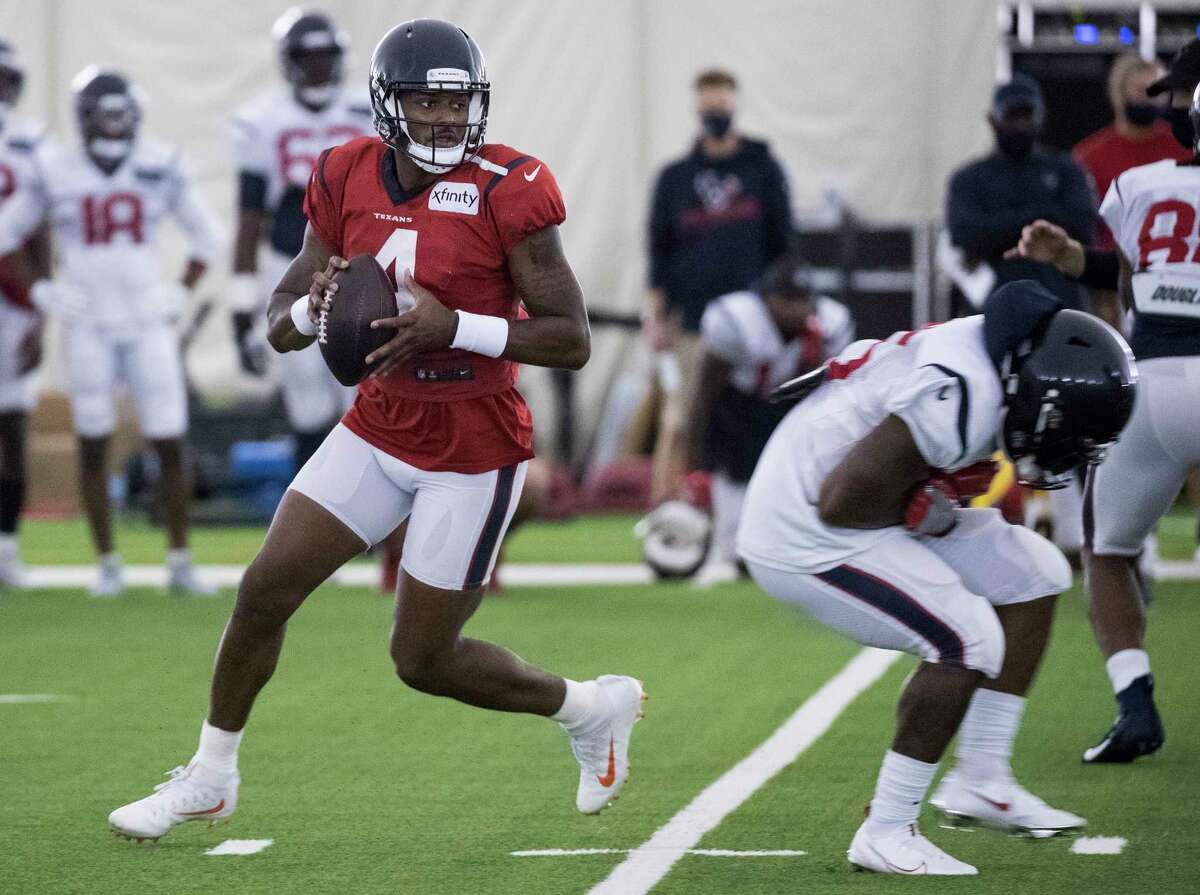 Houston Texans quarterback Deshaun Watson (4) rolls out to pass during an NFL training camp football practice Saturday, Aug. 15, 2020, at The Houston Methodist Training Center in Houston.