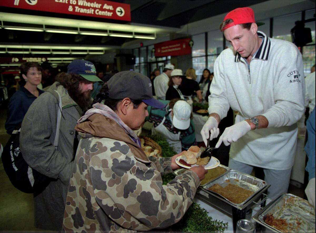 Chris Dudley of the Trail Blazers helps an unidentified man fill up his plate at a dinner for the homeless and the less fortunate in Portland, Ore., in 1996. Dudley, a former Yale star, has seen the Chris Dudley Foundation work with players with Type 1 diabetes for the last 25 years.