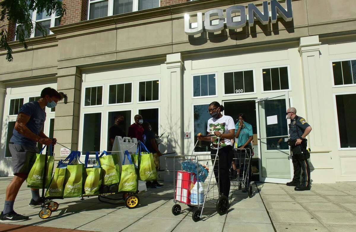 About 265 University of Connecticut-Stamford students moved into downtown residence halls on Friday.