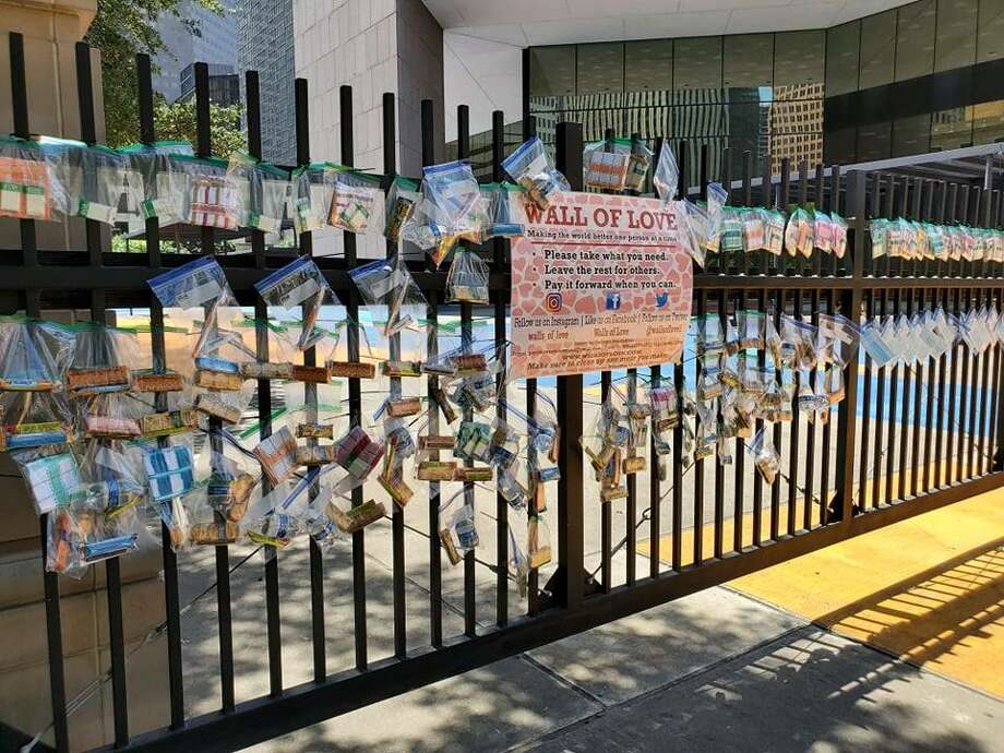 Walls of Love was created by founder Holly Jackson with the mission of providing basic necessities within regions of poverty in various cities including Houston. &gt;&gt;&gt;These photos depict the wall located in downtown Houston near City Hall that went up last week.  Photo: Courtesy: Walls Of Love