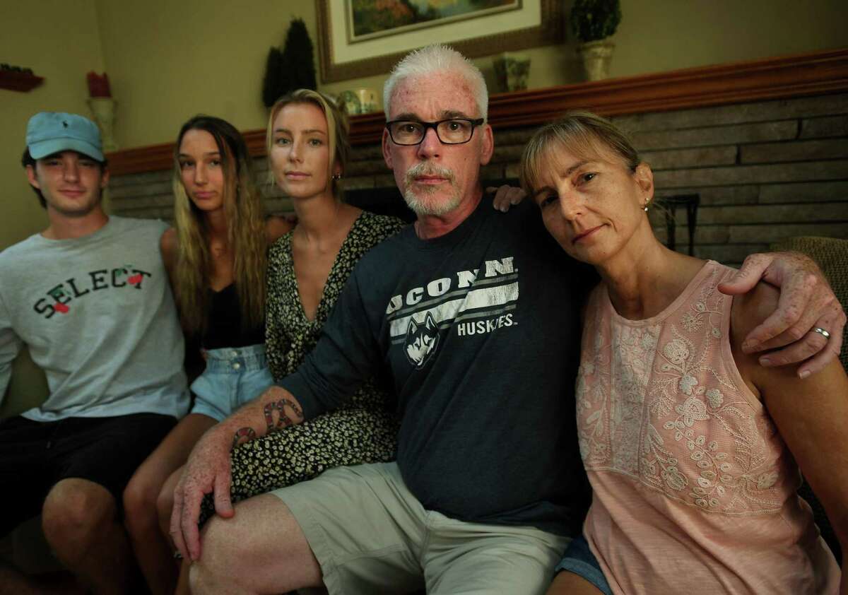 Wally and Niki Beddoe with their children, from left, Kirk, 22; Amy, 16, and Carly, 26; at their home in Trumbull on Tuesday. The Beddoe’s recently lost their 25-year-old son and brother, Jake, from accidental fentanyl ingestion.