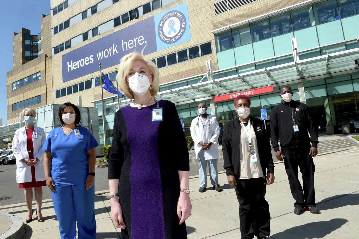Cynthia Sparer (center), Senior VP of Operations and Executive Director of Women's and Children's Services, is photographed outside of the Yale New Haven Hospital Emergency room with (from left) Dr. Elena Ratner, Patient Services Manager Camisha Taylor, Certified Nurse Mark Giles, Mary Graham of Environmental Services and Kevin Burgess of Environmental Services on May 21, 2020.