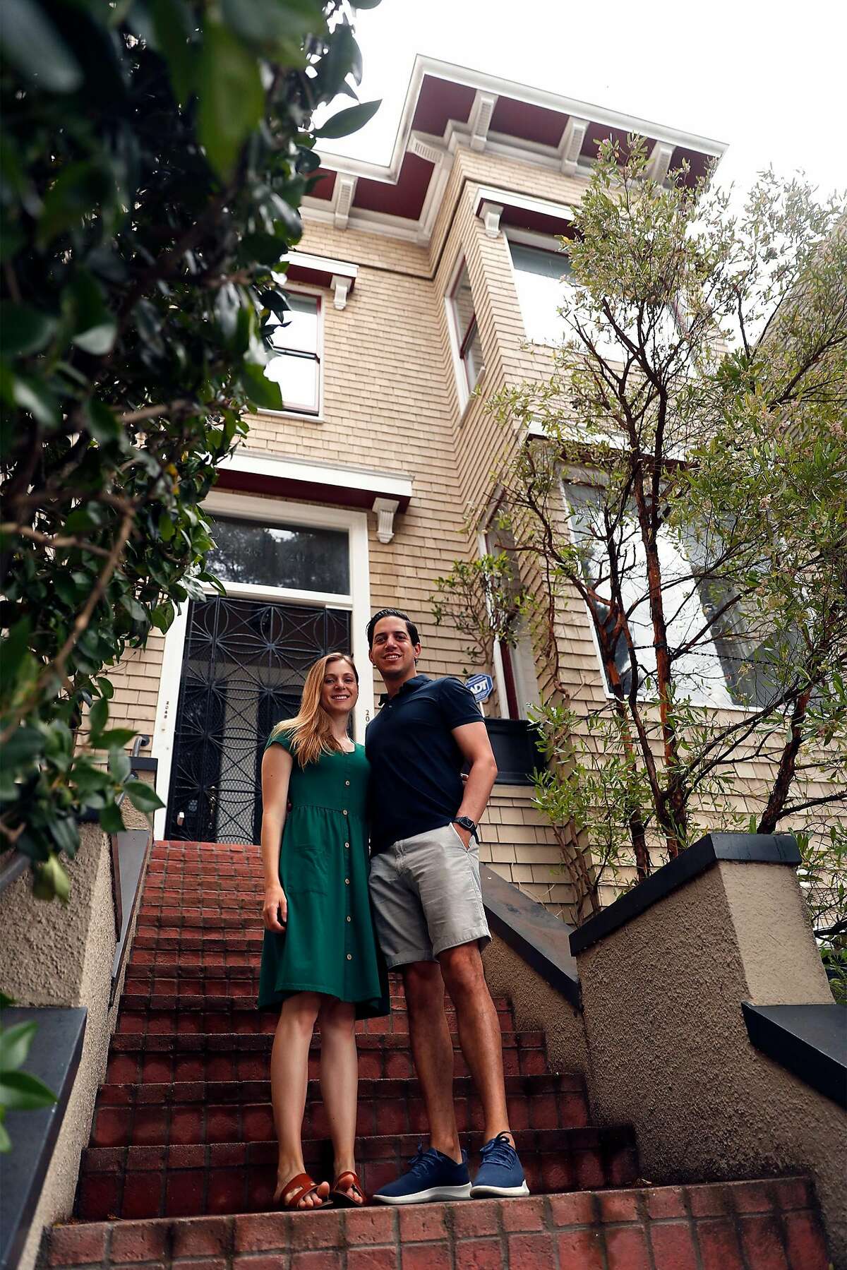 Shanna Wagnor and her husband, Sean Lewis, in front of their Pacific Heights condo in San Francisco, Calif., on Sunday, August 16, 2020. The couple are selling their San Francisco residence after buying a larger house in Piedmont.