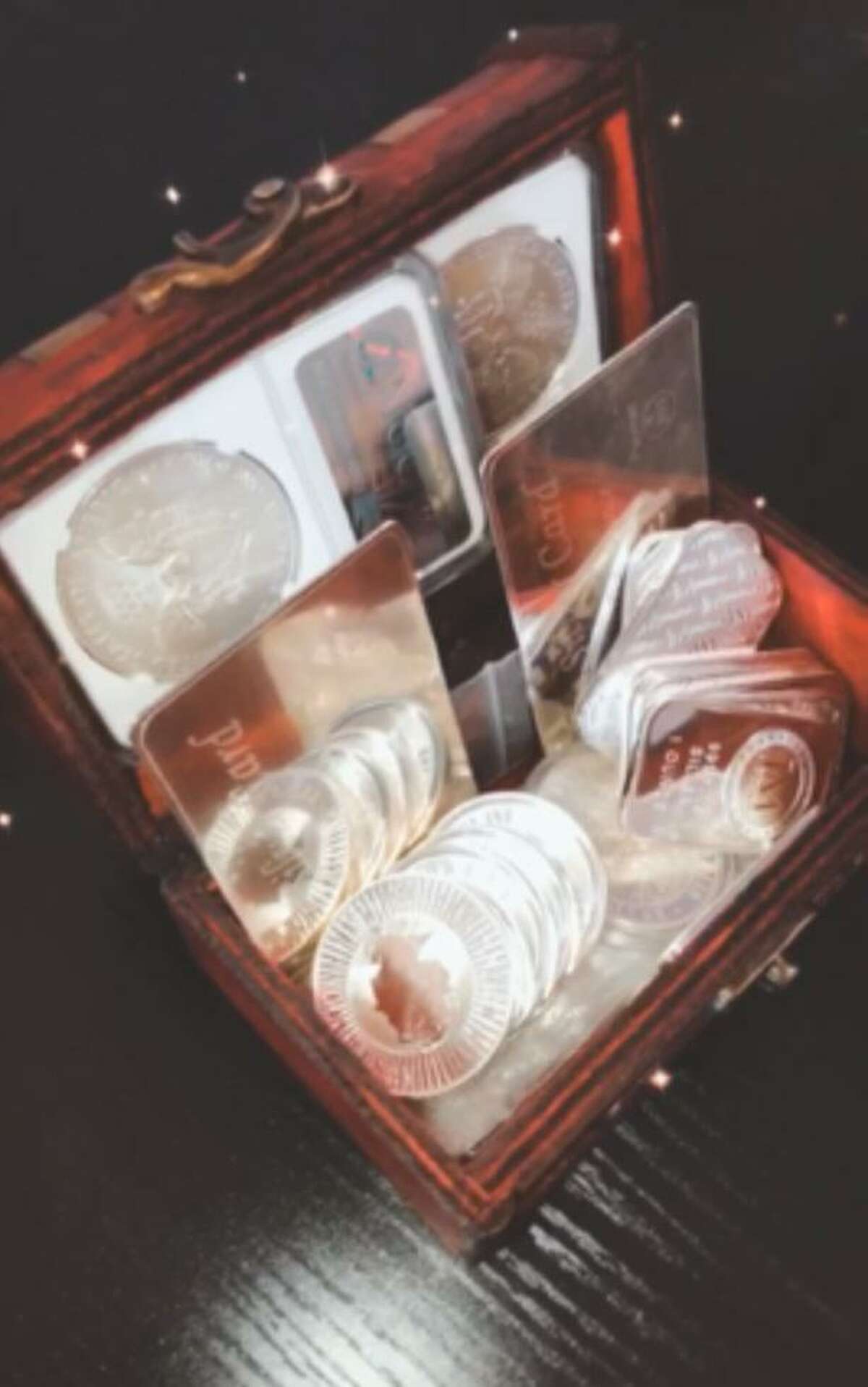 Shown is the treasure worth at least $600 which contains over 19 ounces of silver and 40 Sacagawea coins.