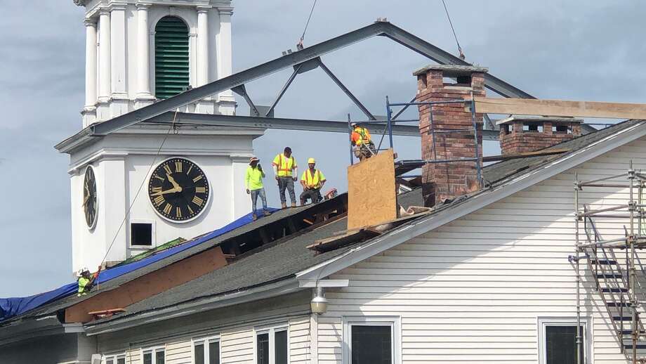 New beam marks major milestone in church construction project New