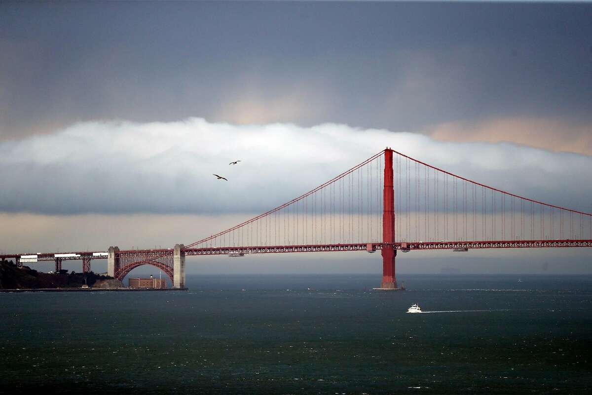 A storm moves behind Golden Gate Bridge as viewed from Alcatraz Island in San Francisco, Calif., on Monday, August 17, 2020.
