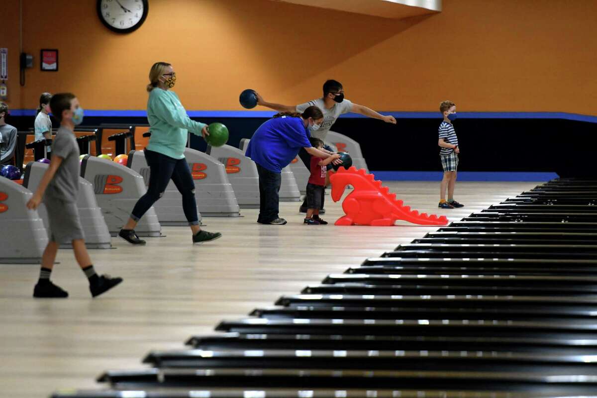 Bowlers take to the lanes during the first day of reopening for bowling centers under the state's coronavirus guidelines on Monday, Aug. 17, 2020, at Kingpin's Alley in South Glens Falls, N.Y. (Will Waldron/Times Union)