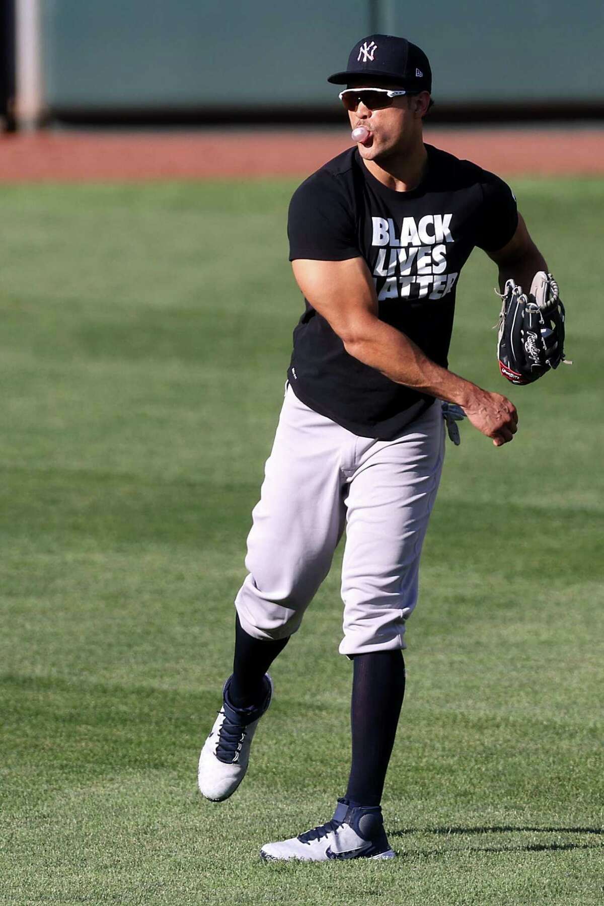New York Yankees' Giancarlo Stanton warms up during a team workout  Wednesday, March 27, 2019, in New York. The Yankees will play their home  opener against the Baltimore Orioles on Thursday. (AP