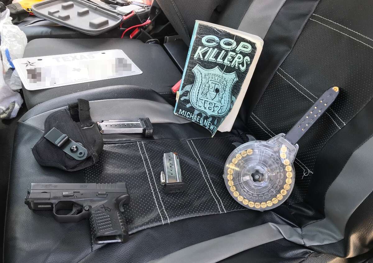 On Tuesday, the Sheriff's Office released a picture of items allegedly found in the vehicle the pair was driving. The items include a gun and a copy of "Cop Killers," a 1998 book by Michael Newton.