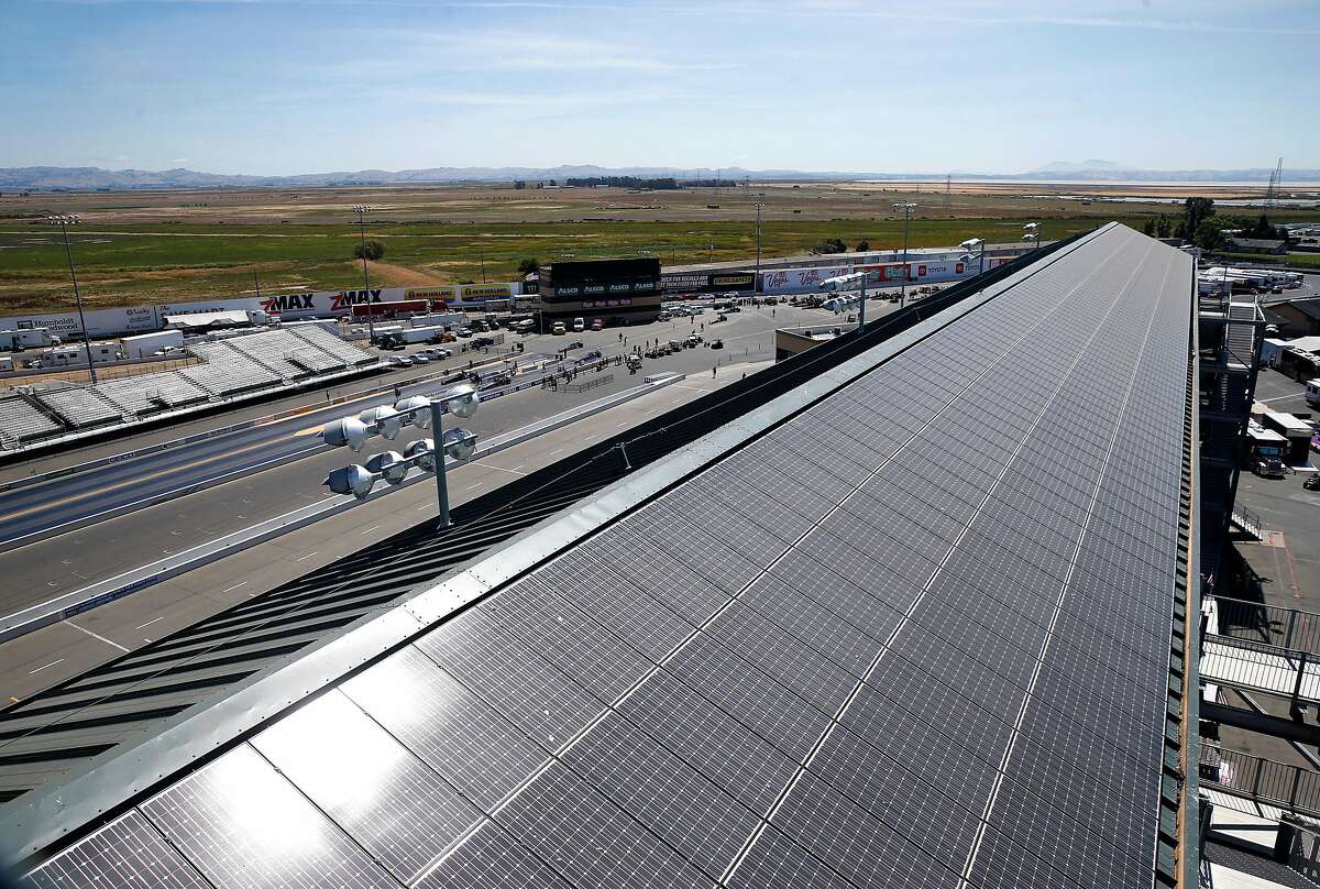 Solar panels on the roof of the main grandstand collect energy from the sun at Sonoma Raceway in Sonoma, Calif. on Thursday, July 18, 2019. The race track, which is celebrating its 50th anniversary this season, is taking strides in reducing its carbon footprint.
