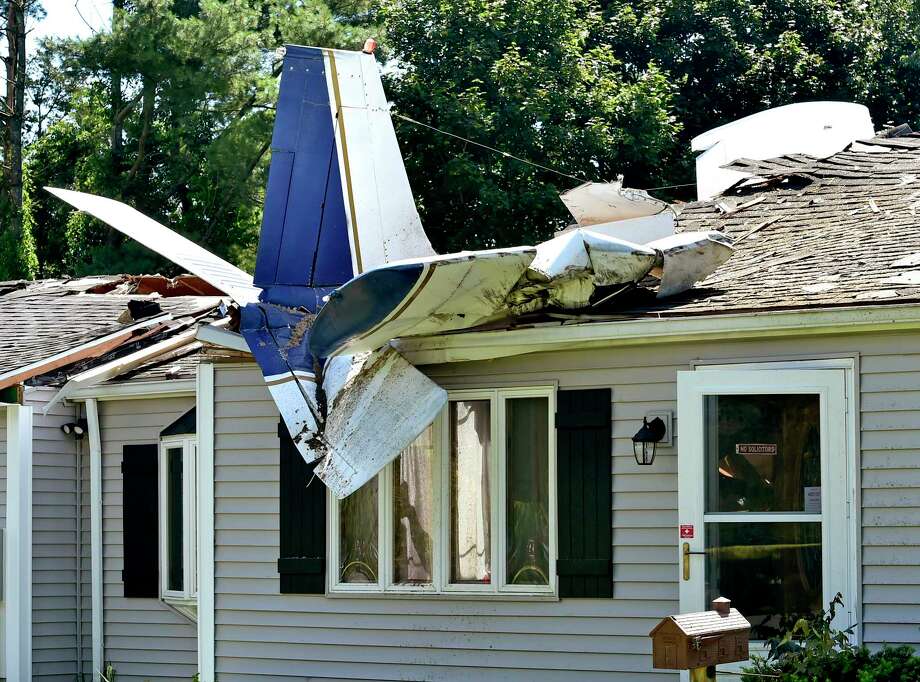 Groton, Connecticut - Tuesday, August 18, 2020: No one was injured after a small plane crashed into an occupied house Monday night at 243 Ring Avenue in Groton. Police said the airplane’s two occupants were able to self-extricate themselves and were transported by ambulance to Lawrence + Memorial Hospital in New London. Kenneth Johnson, 73, the owner of the house who was inside the house at the time of the crash, was not injured. Photo: Peter Hvizdak, Hearst Connecticut Media / New Haven Register