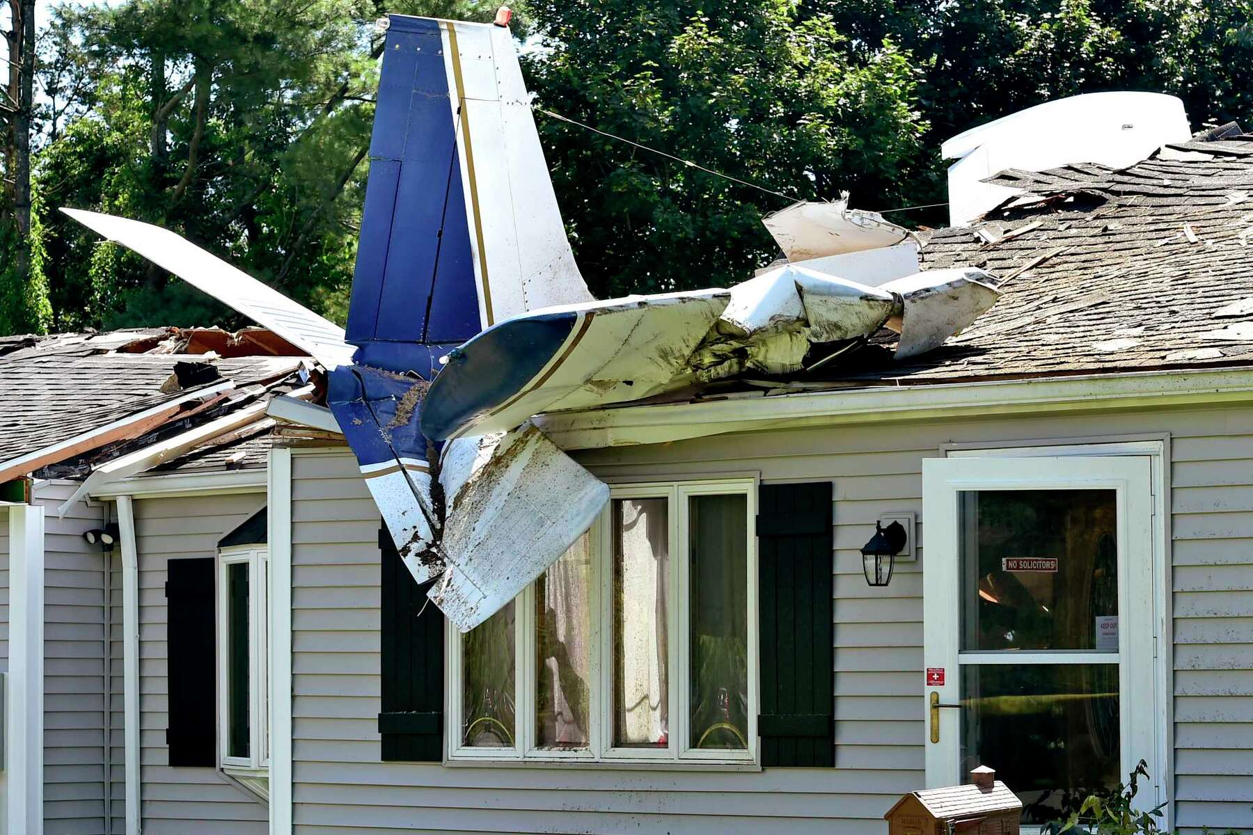 Miracle': Homeowner, pilot & passenger survive after plane crashes into CT  house