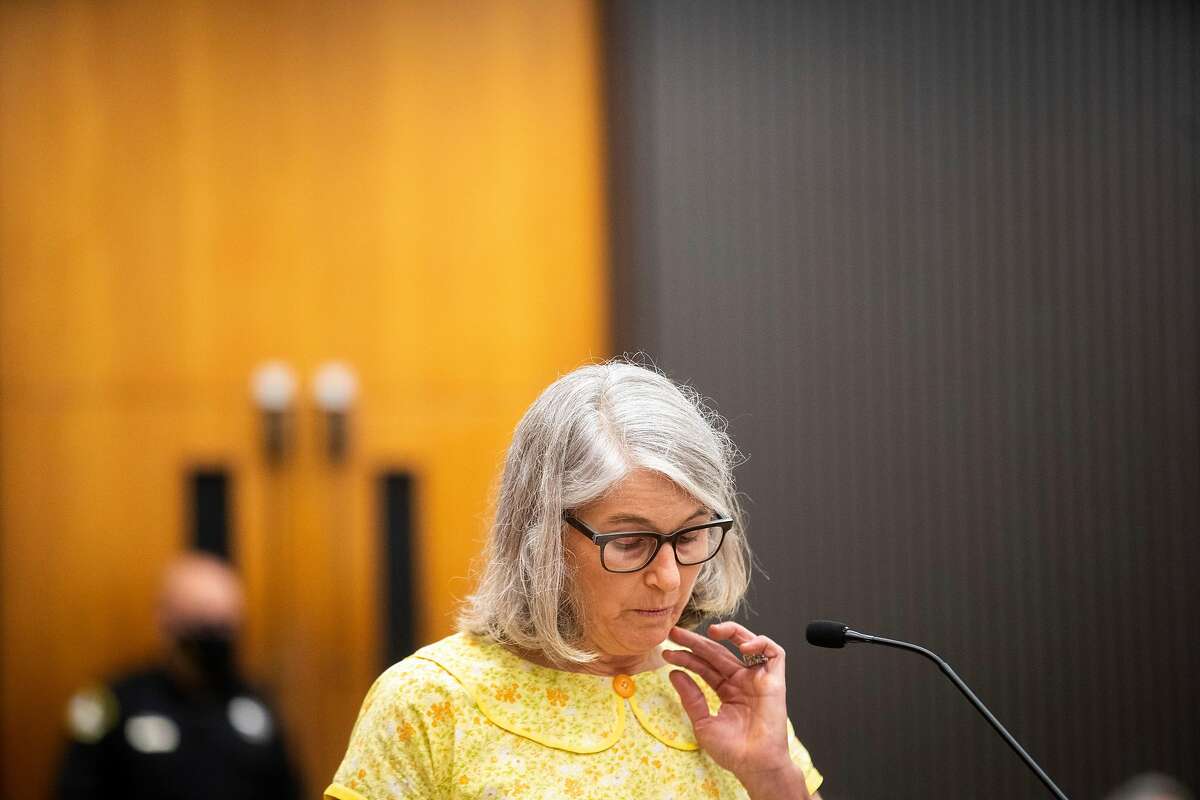 Peggy Frink reads a statement at the podium as Joseph James DeAngelo is in the court room during the first day of victim impact statements at the Gordon D. Schaber Sacramento County Courthouse on Tuesday, Aug. 18, 2020, in Sacramento. DeAngelo admitted to more than 50 rapes, including some in Santa Clara, Contra Costa and Alameda counties, but the statute of limitations expired on those crimes. DeAngelo, who admitted being the infamous Golden State Killer, listened in to the final statements of his victims and their families, before his sentencing on Friday. Frink, the second victim of the “East Area Rapist,” approached the podium and recalled how she was 15 when DeAngelo broke into her family home and raped her repeatedly while her sister was tied up in another room.