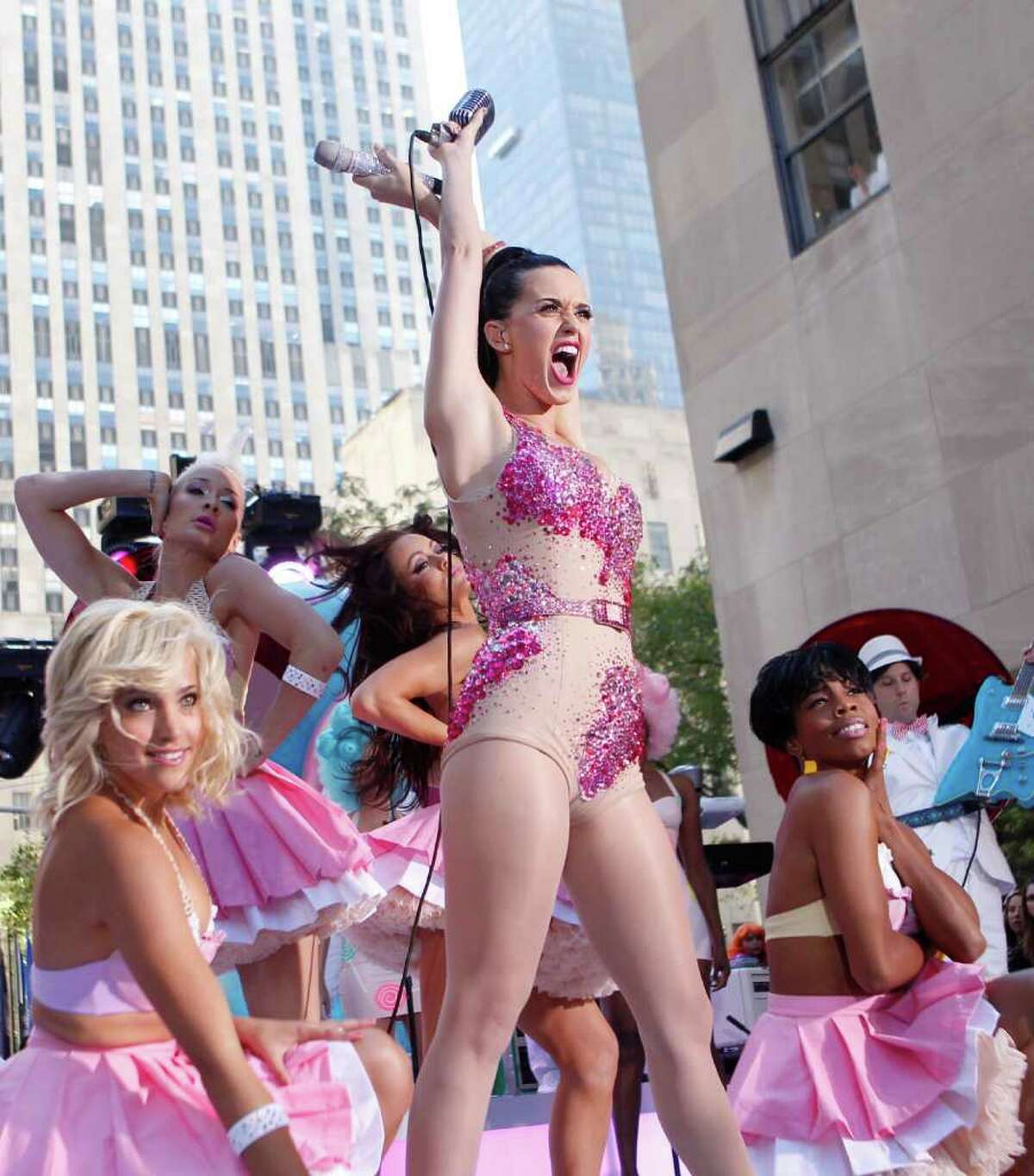 Singer Katy Perry, center, performs on NBC's "Today" in New York's Rockefeller Center Friday, Aug. 27, 2010. (AP Photo/Jason DeCrow)