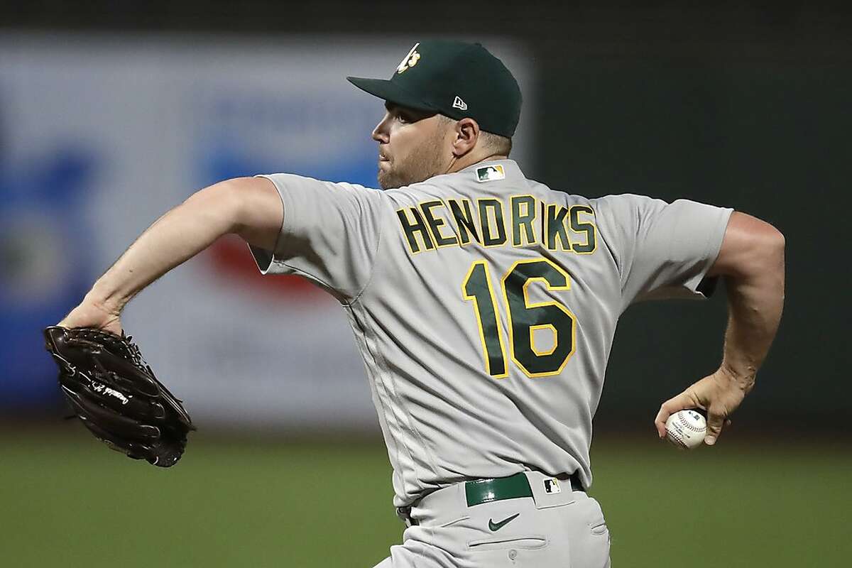 Oakland Athletics pitcher Liam Hendriks works against the San Francisco Giants in the tenth inning of a baseball game Friday, Aug. 14, 2020, in San Francisco. (AP Photo/Ben Margot)