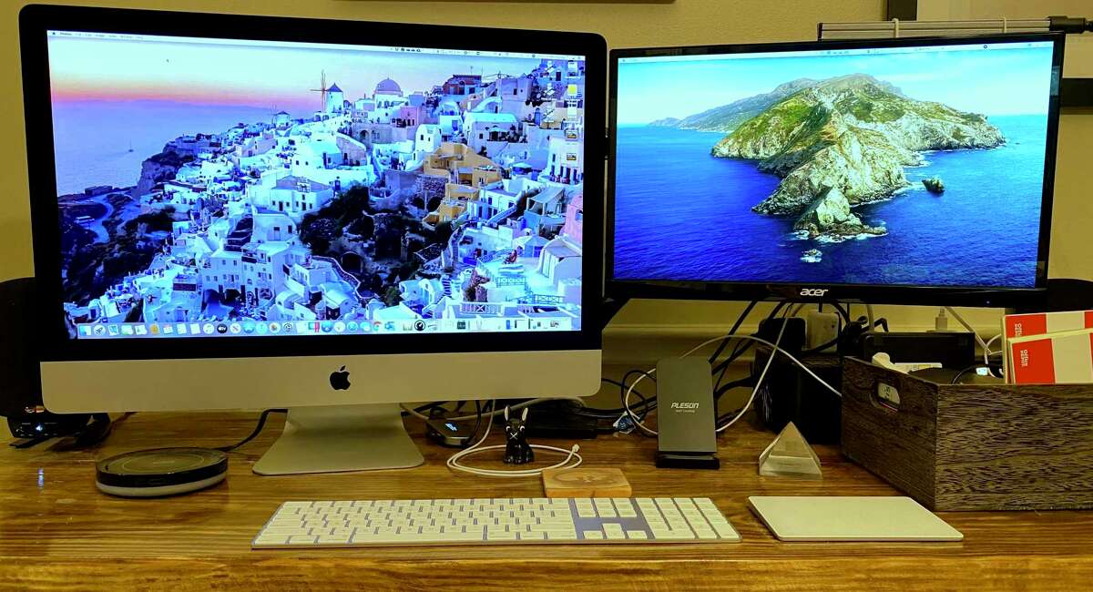 Apple's updated 27-inch iMac with 5K Retina display, left, is likely the last of that line to have an Intel-based processor. It's shown here with a 22-inch Acer HD monitor as the secondary display.