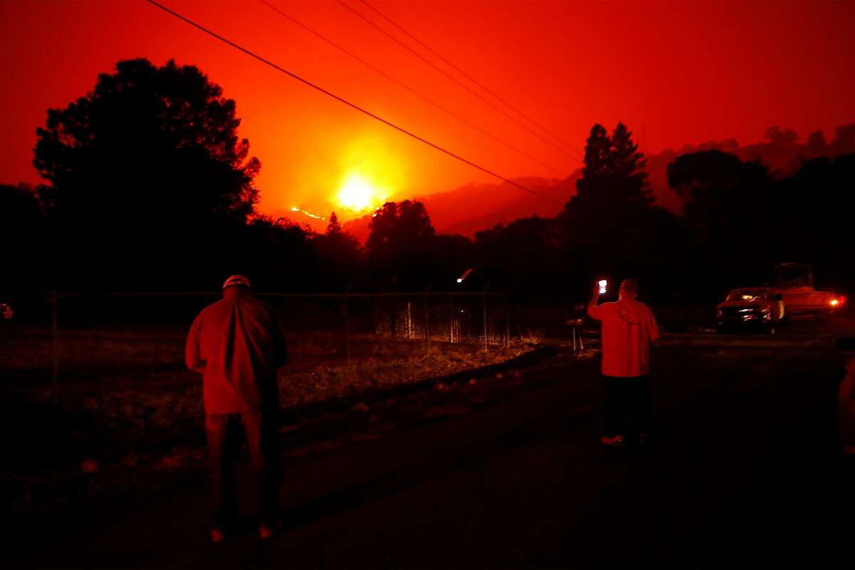 Nearby residents watch LNU Lightning Complex Fire along Cherry Glen Road in Vacaville , Calif., on Wednesday, August 19, 2020.