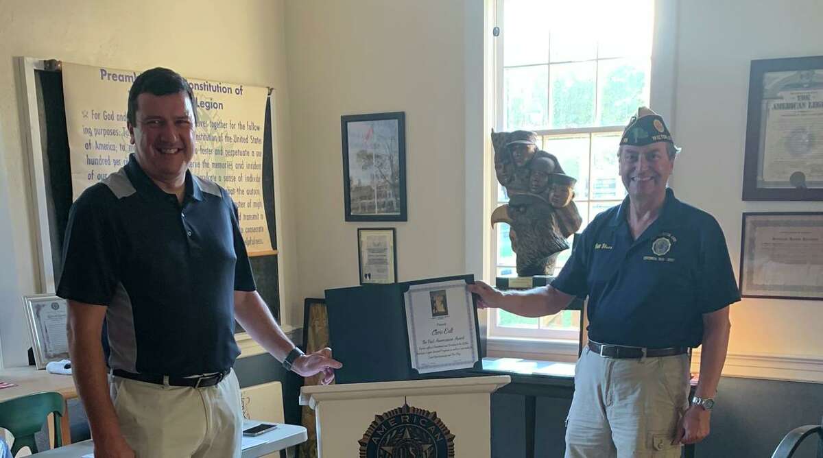 American Legion Post 86 Commander Bill Glass, right, presents Chris Eidt with the Post 86 Americanism Award on Aug. 11.