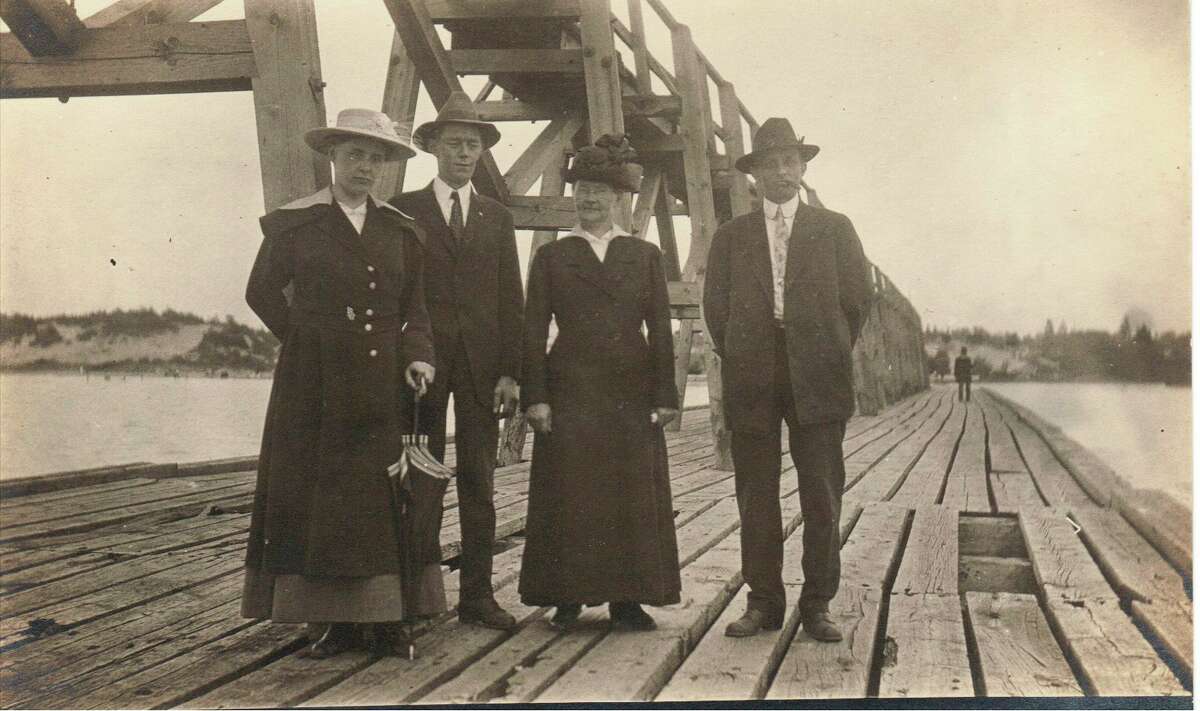 A group of visitors pose for a photo on the Manistee pier circa 1930s. (Manistee County Historical Museum photo)