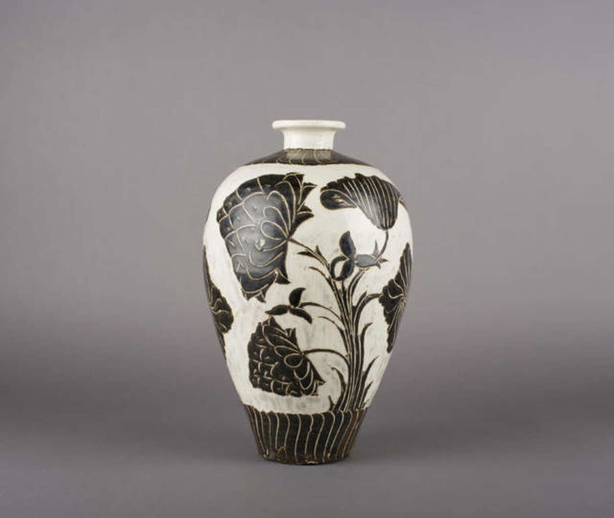 “Prunus Vase (meiping) with Design of Lotus Blossoms and Leaves”, 11th-early 12th century; Chinese, Northern Song dynasty; Cizhou ware; stoneware with white slip and black glaze with sgraffiato decoration; 12 5/16 inches; Saint Louis Art Museum, Bequest of Samuel C. Davis 949:1940