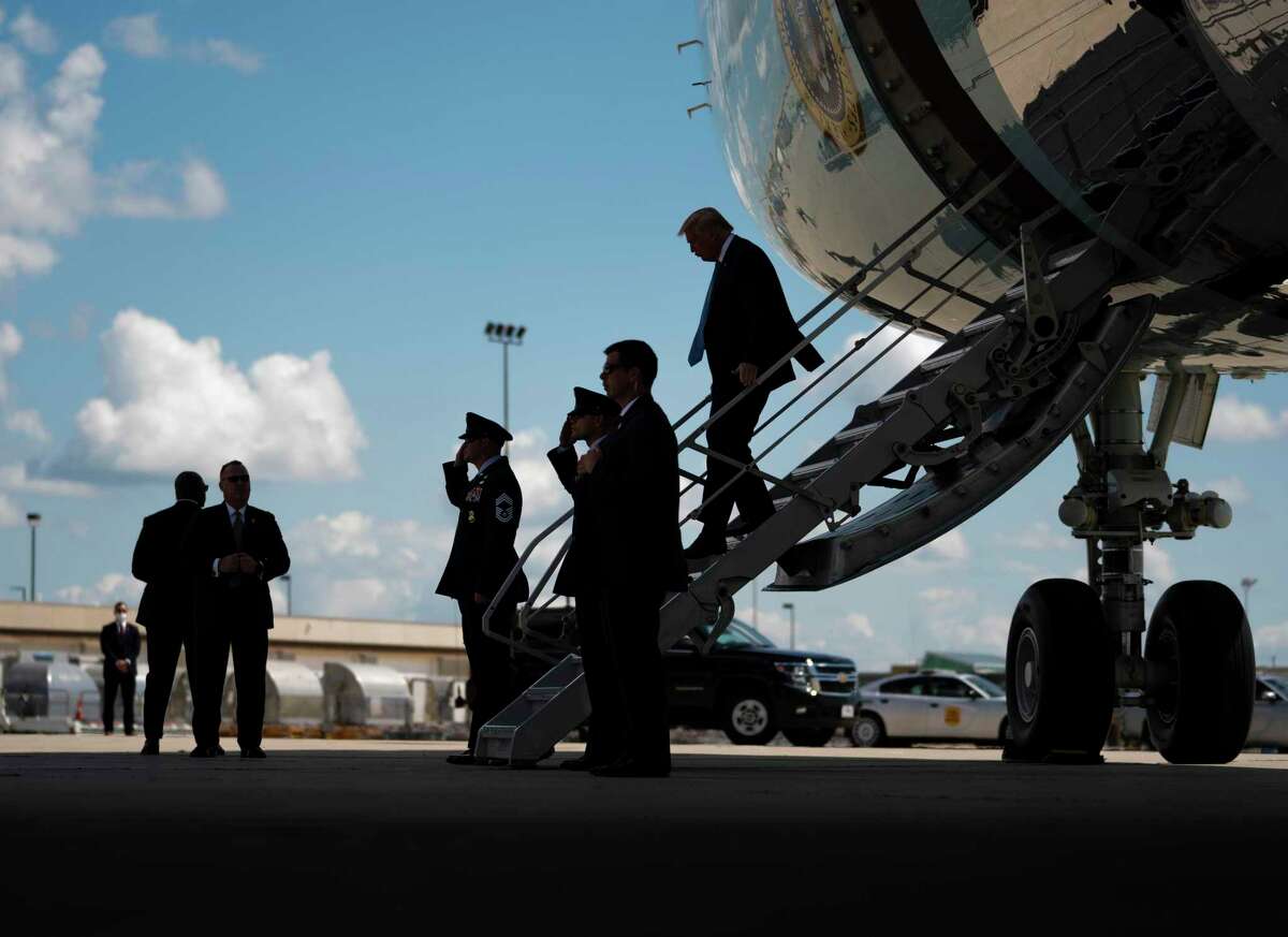 President Donald Trump departs Air Force One upon arrival in Cedar Rapids, Iowa, Tuesday, Aug. 18, 2020.