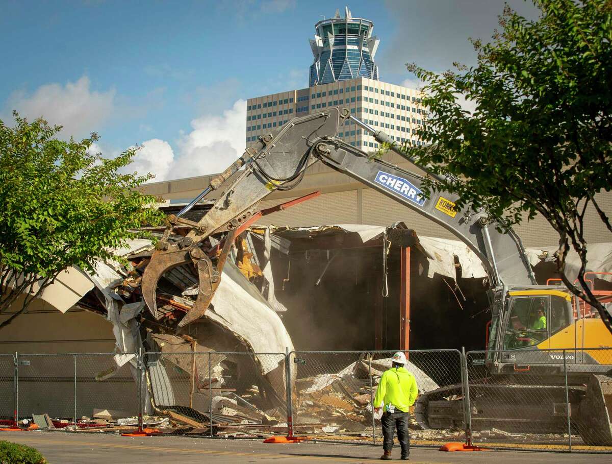 The former Sears store that existed for decades at Memorial City Mall is demolished Tuesday, Aug. 11, 2020, in Houston.
