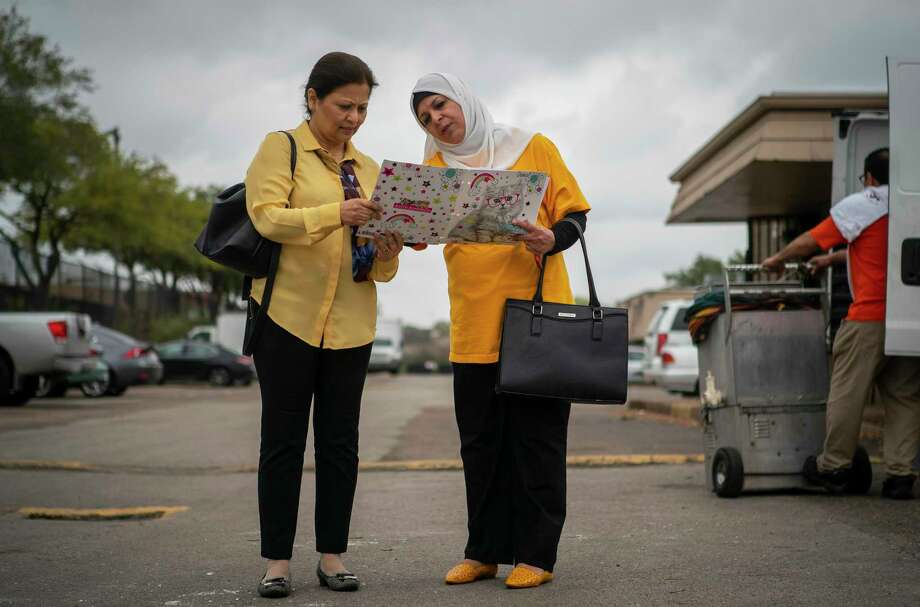 Aisha Siddiqui (left), the founding director of Culture of Health-Advancing Together (CHAT), and Halah Abbood talk about their work spreading the word about the coming 2020 census to a mostly refugee community, Monday, March 2, 2020, at the Ashford Crescent Oaks apartments in Houston's Gulfton neighborhood. Abboodm, a new U.S. citizen who is originally from Iraq, has been working to get community members to sign a pledge card that they will fill out the 2020 Census. Photo: Mark Mulligan, Houston Chronicle / Staff Photographer / © 2020 Mark Mulligan / Houston Chronicle