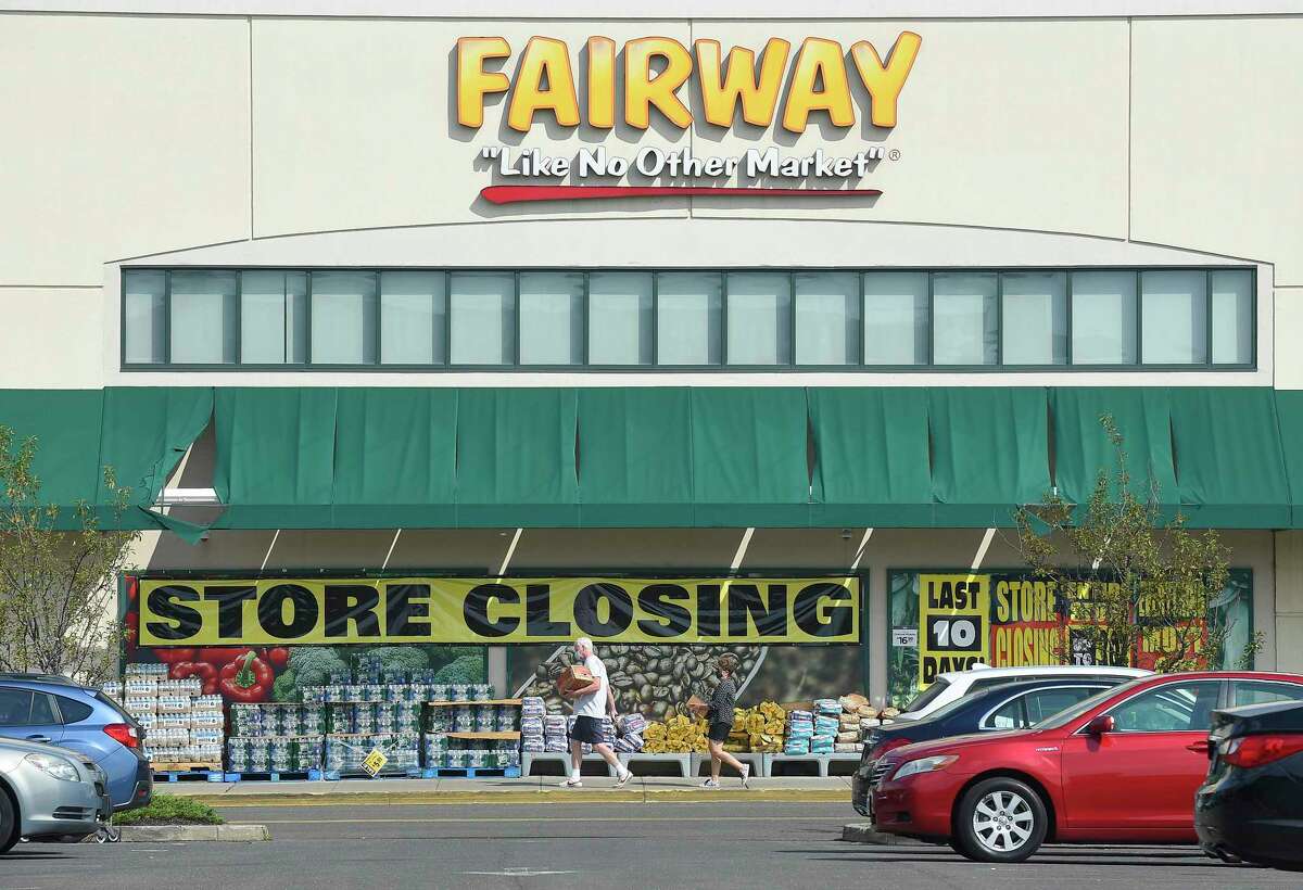 Customers of Fairway Market are greeted with store closing signs as they shop on Aug. 12, 2020, at the store at 699 Canal St., in Stamford, Conn.