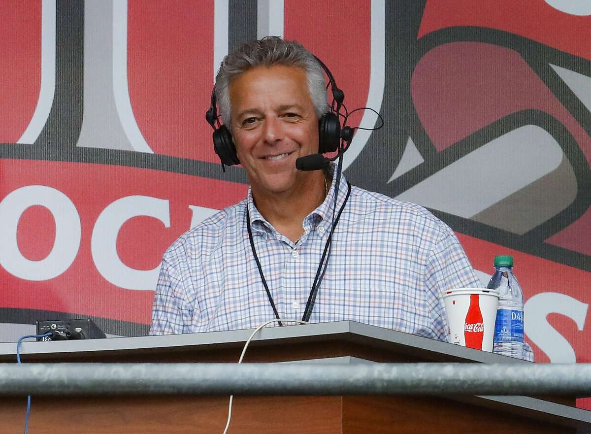FILE - In this Sept. 25, 2019, file photo, Cincinnati Reds broadcaster Thom Brennaman sits in a special outside booth before the Reds' baseball game against the Milwaukee Brewers in Cincinnati. Brennaman used a gay slur during the broadcast of Cincinnati's game against the Kansas City Royals on Wednesday, Aug. 19, 2020. Brennaman used the slur moments after the Fox Sports Ohio broadcast returned from a commercial break before the seventh inning in the first game of a doubleheader. Brennaman did not seem to realize he was already on air. (AP Photo/John Minchillo, File)