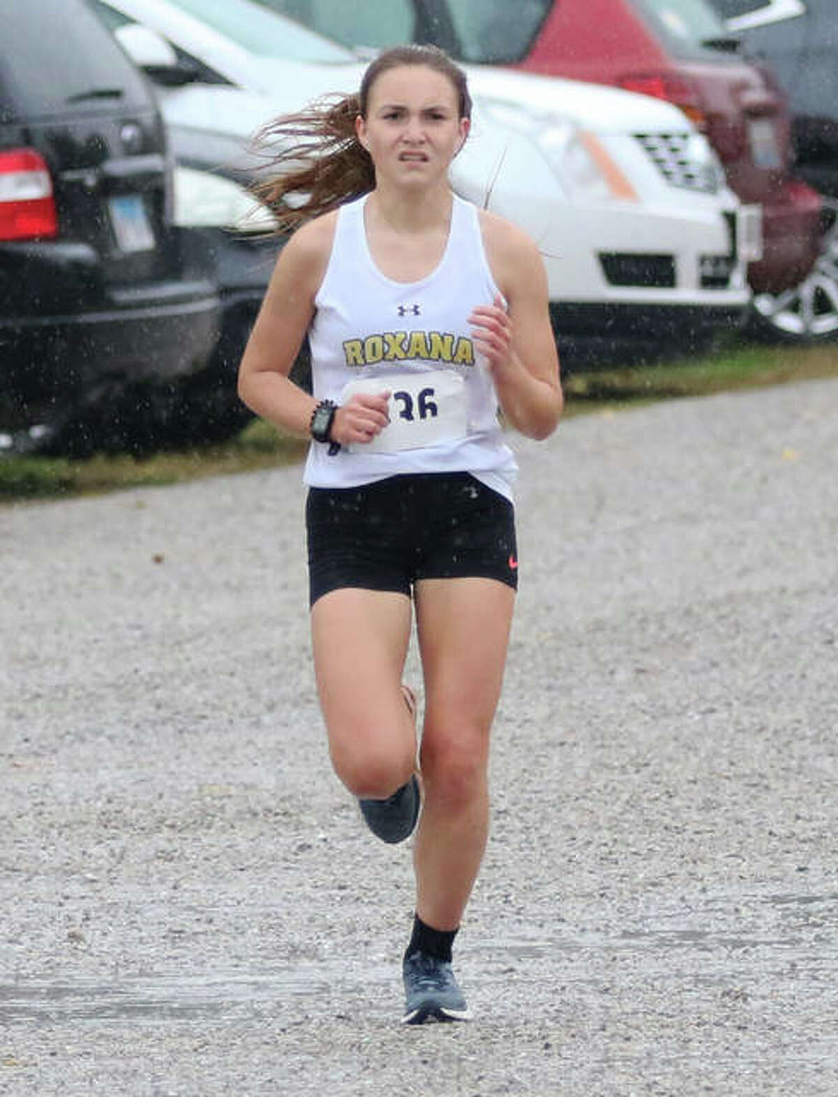 Roxana senior Keiko Palen runs in the rain during last season’s New Athens Class 1A Regional. Palen, who ran fifth in the regional, and classmate Janelynn Wirth return to lead what project as a big season for Shells girls cross country.