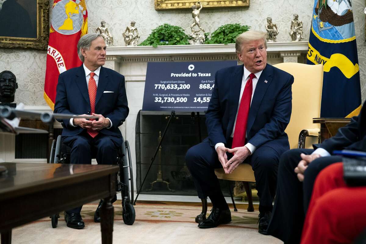 President Donald Trump (R) speaks to reporters while hosting Texas Governor Greg Abbott about what his state has done to restart business during the novel coronavirus pandemic in the Oval Office at the White House May 07, 2020 in Washington, DC.